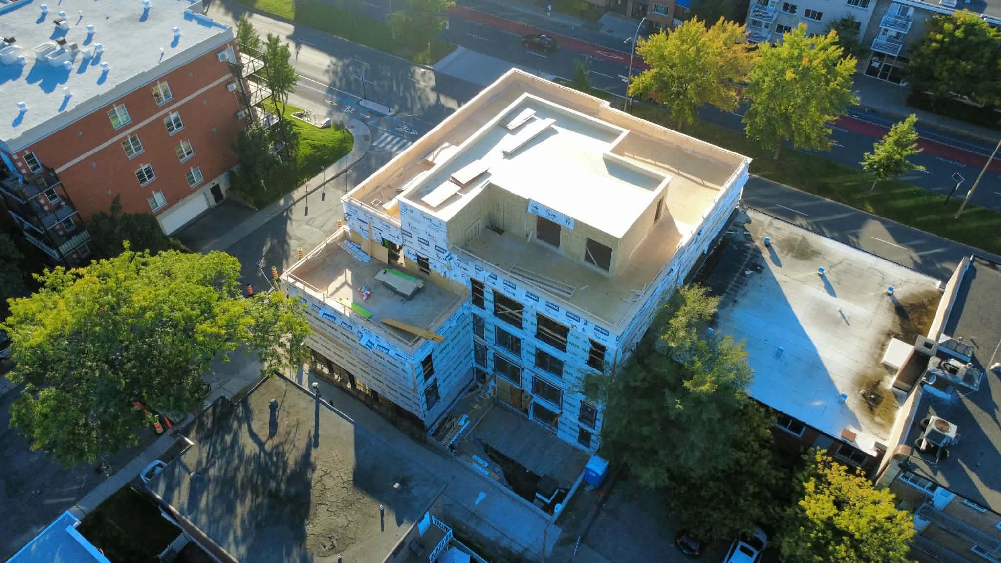 Aerial view of the Le Phénix construction site showing the upper level and outdoor spaces under construction